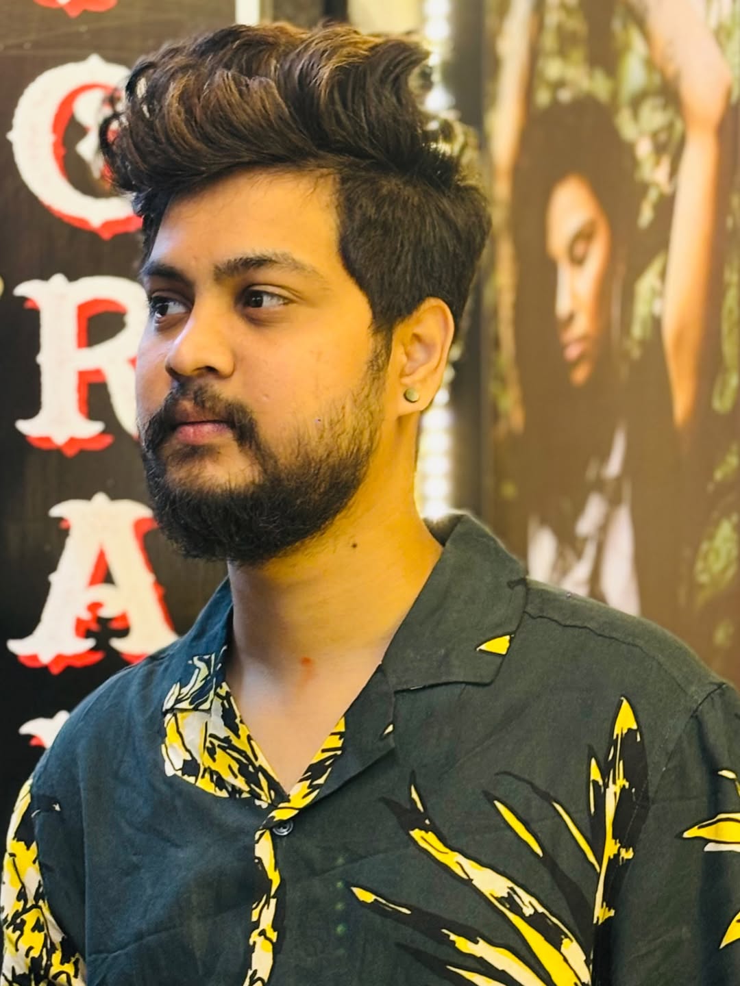 Tattoo artist Nikky seated in the studio