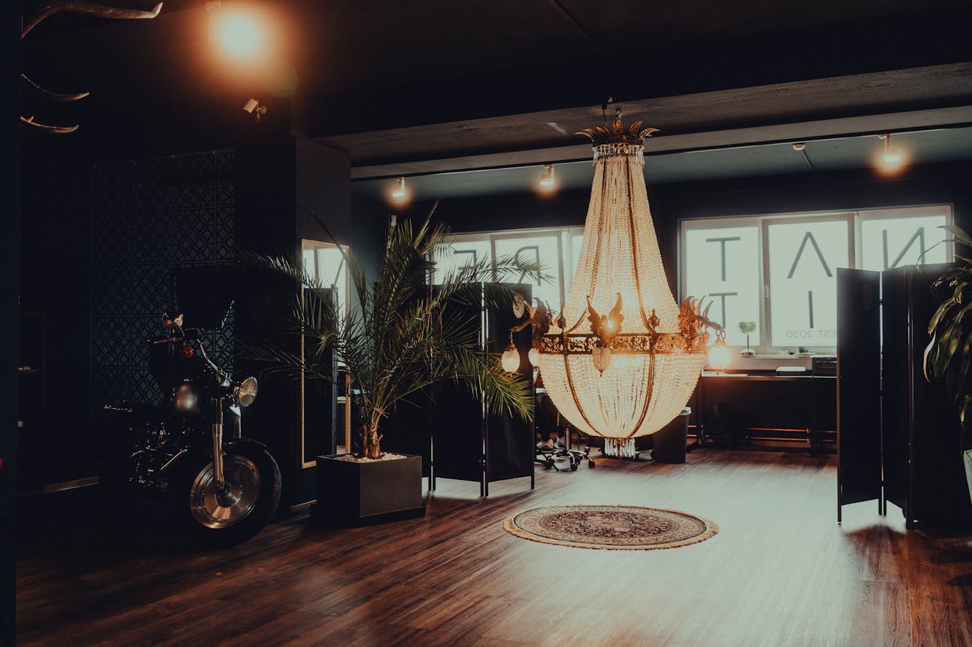 Luxury tattoo studio interior with chandelier lighting