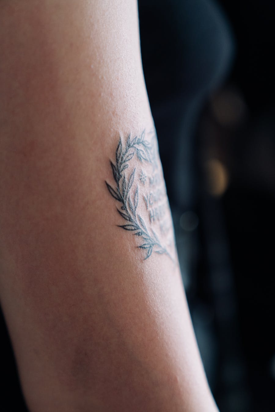 Fine line botanical tattoo detail